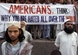 Activists of Pakistan militant religious parties stand in front of an anti-American banner during a rally in Islamabad, Pakistan Saturday, Sept. 15, 2001. They feared that the U.S. will attack neighboring Afghanistan in retaliation of Tuesday's attacks in New York and Washington. (AP Photo/B.K.Bangash)